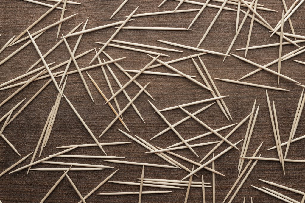 Wooden Toothpicks On The Table Background